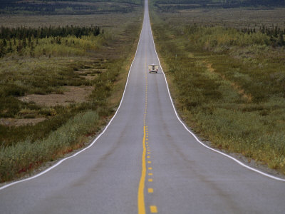 melford-michael-truck-driving-down-a-long-straight-road-in-a-rural-area.jpg