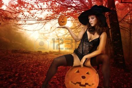 15290918-sexy-girl-in-witch-costume-for-halloween-in-a-forest.jpg